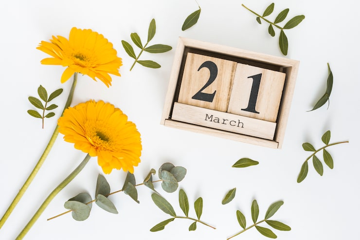 Foto gratuito inscripción del 21 de marzo con flores amarillas de gerbera.