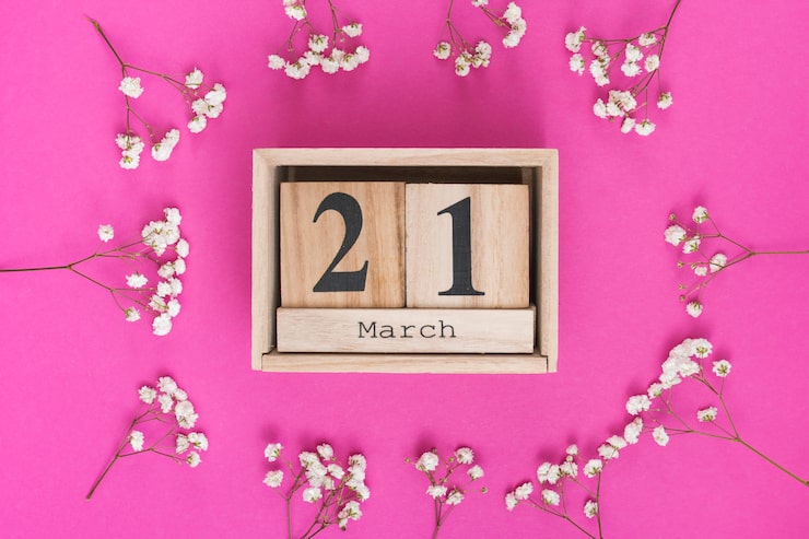 Foto gratuito inscripción del 21 de marzo con ramas de flores blancas.