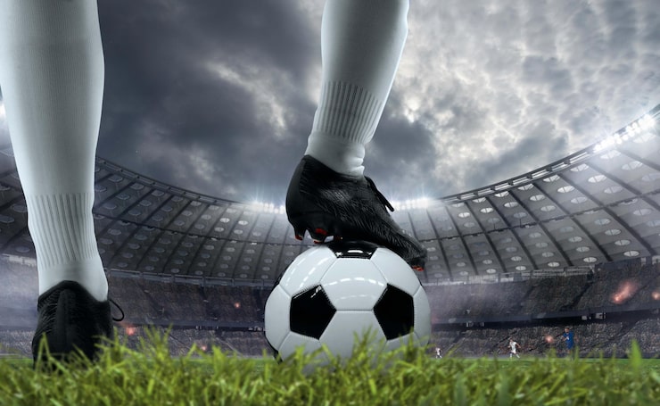 Foto gratuito jugadores de fútbol en acción en un estadio profesional