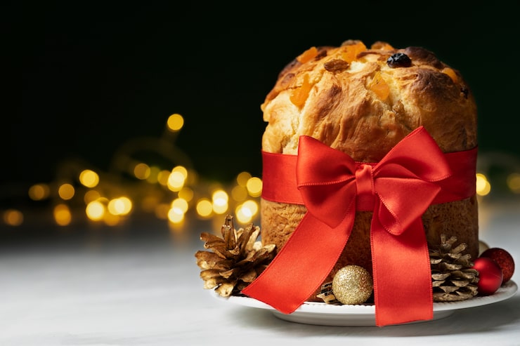 Foto gratuito delizioso panettone di natale con nastro