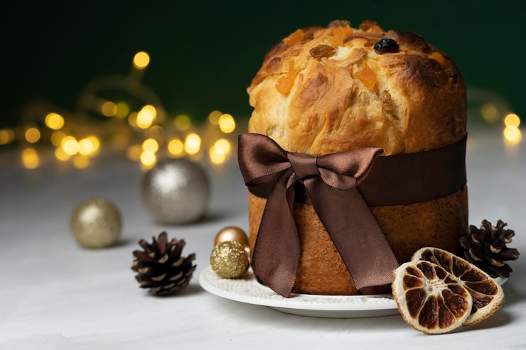 Foto gratuito panettone natalizio con nastro marrone