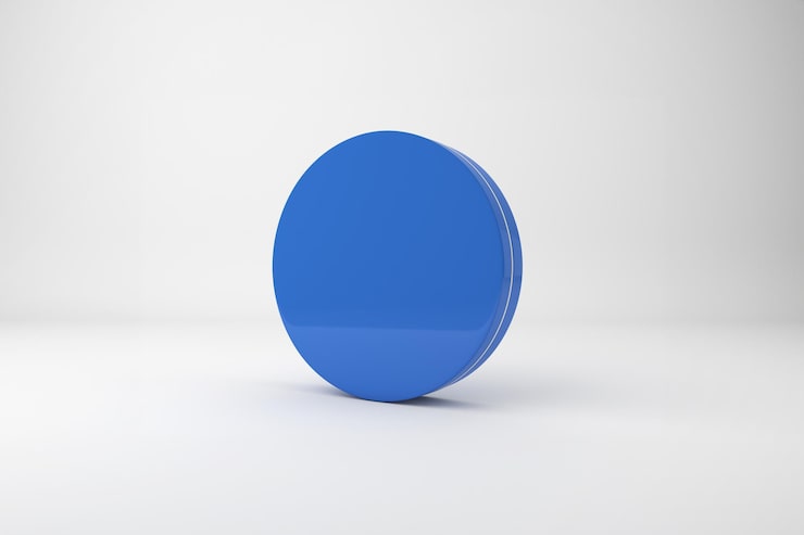 Foto gratuito un cerchio blu lucido su uno sfondo bianco