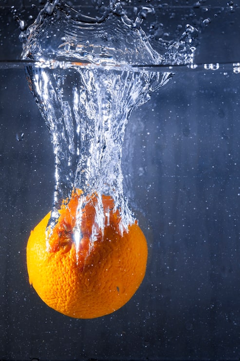 Foto grátis laranja em água com bolhas