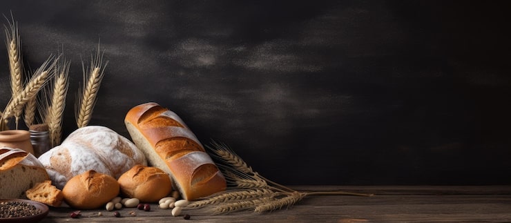 Foto pan de estilo campestre o baguette francés trigo y harina en pizarra fondo rural o de panadería