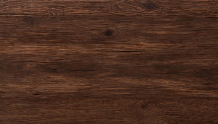Foto un primer plano de un piso laminado de nuez oscuro con una mancha oscura