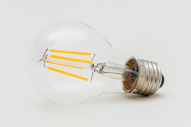 Gratis Bild edison glödlampa på en grå bakgrund