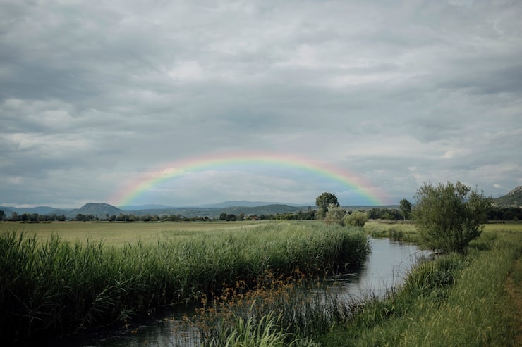 Gratis Bild vackert landskap med regnbåge och flod