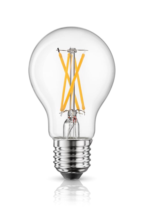 Bild led-glödlampa med glödtråd med e27-sockel isolerad på vitt