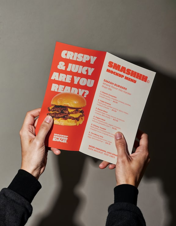 Hands holding  trifold brochure mockup