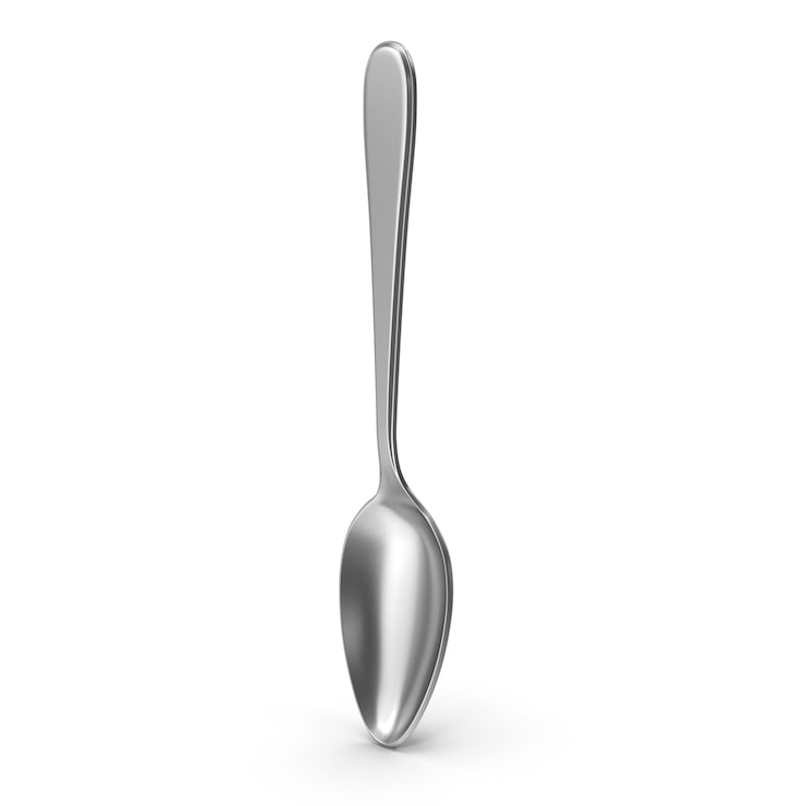 PSD cucharilla de plata brillante de pie sobre fondo blanco
