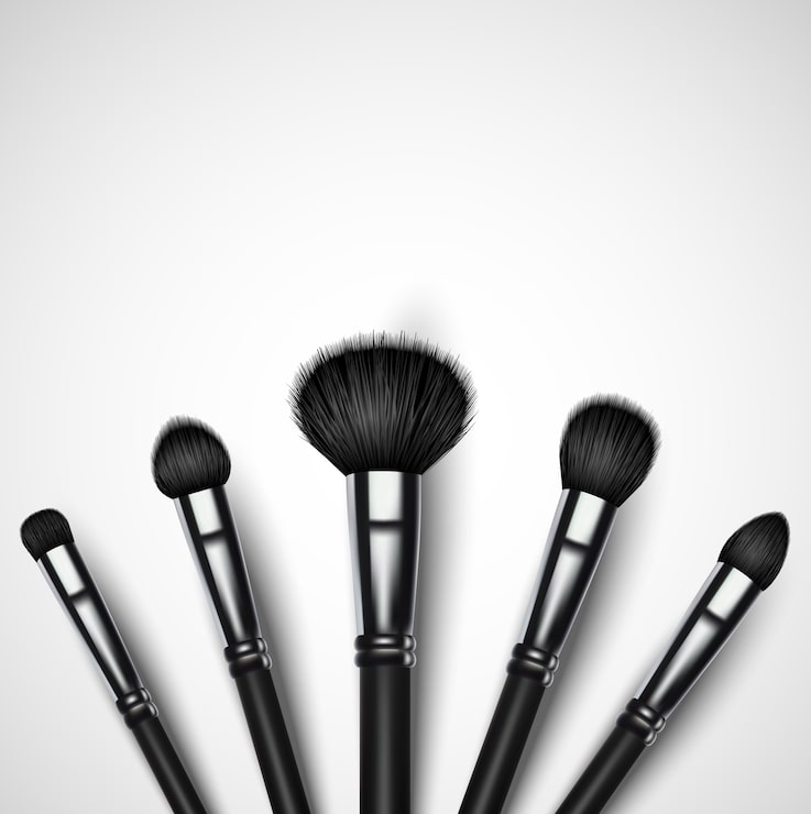 Vector conjunto de pinceles de maquillaje sobre fondo blanco